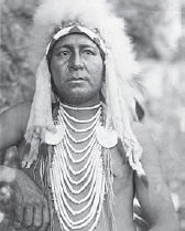 Edward S. Curtis, Upshaw—Apsaroke, ca. 1905 (LC-USZ62-124178, published in:The North American Indian/Edward S. Curtis. [Seattle, Wash.]: Edward S. Curtis, 1907–30, Suppl. v. 4, pl. 139; Library of Congress; Christopher M. Lyman writes in The Vanishing Race and Other Illusions, “A.B. Upshaw, a Crow Indian, worked for Curtis as an interpreter. For this portrait he wore a costume so as to appear ‘Indian’ to Curtis’s viewers.” See The Vanishing Race and Other Illusions: Photographs of Edward S. Curtis, New York: Pantheon Books, 1982, 92)