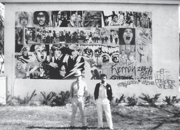 Willie Herrón and Gronk in 1979 in front of Black and White Mural, 1973 (photograph by Harry Gamboa Jr., copyright Harry Gamboa Jr., courtesy of the UCLA Chicano Studies Research Center)