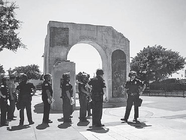 Danzas Indigenas protected by police, Baldwin Park Metrolink station, 2005 (Social and Public Art Resource Center)