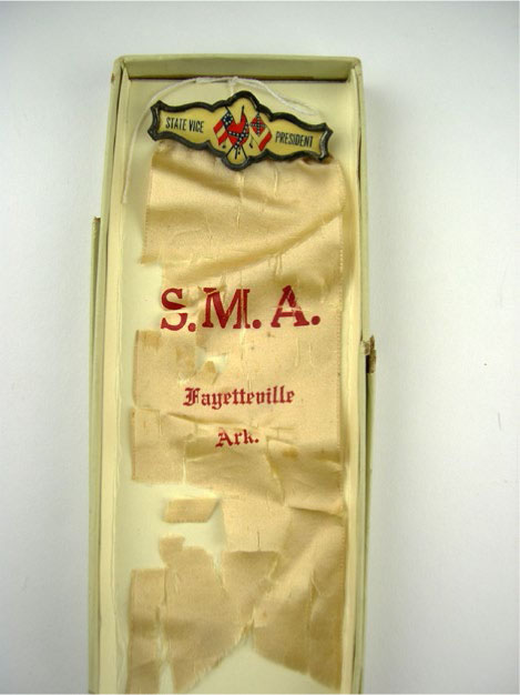 FIGURE 5E.6 DETAIL OF AN ORGANIZATION BADGE WITH SHATTERED SILK RIBBON AND A TARNISHED BAR-STYLE PINBACK WITH SOILED AND YELLOWED CELLULOID INSERT DATING FROM 1900. COURTESY SHILOH MUSEUM OF OZARK HISTORY (S-89-167-36). CREATED BY AUTHOR.