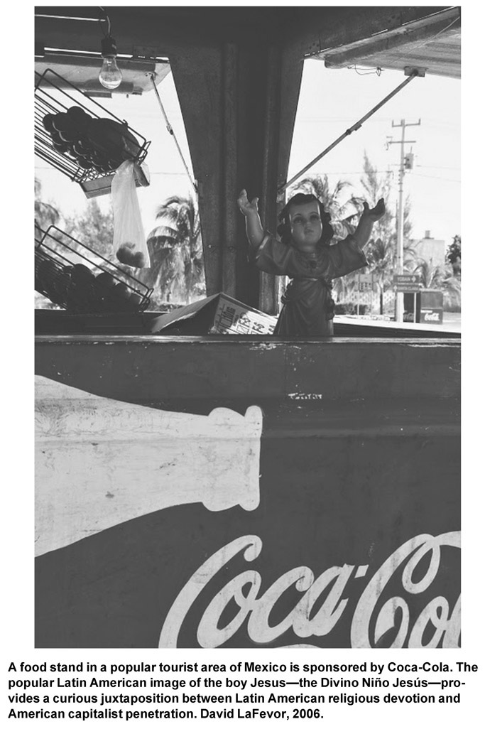 A food stand in a popular tourist area of Mexico is sponsored by Coca-Cola. The popular Latin American image of the boy Jesus—the Divino Niño Jesús—provides a curious juxtaposition between Latin American religious devotion and American capitalist penetration. David LaFevor, 2006.