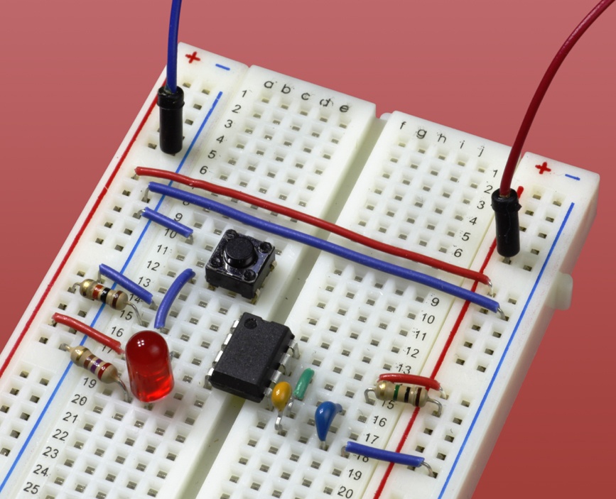 The basic monostable configuration for a 555 timer, mounted on a breadboard.