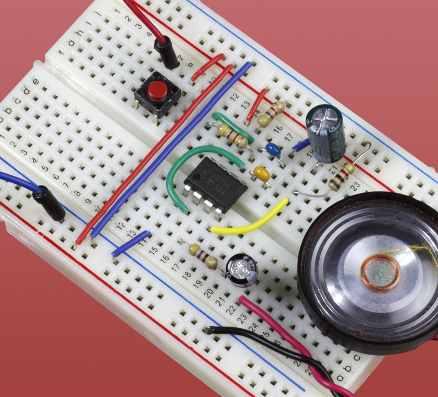 The “burst mode” circuit installed on a breadboard with a miniature loudspeaker.