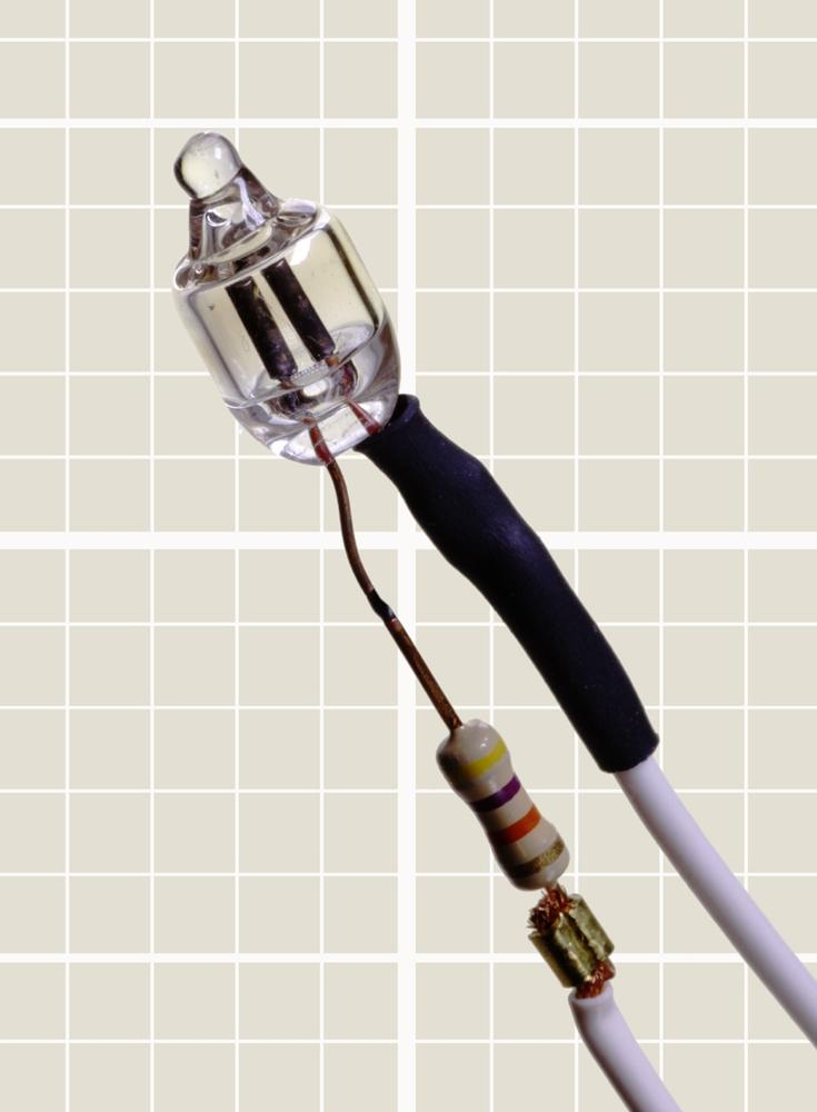 A typical neon bulb with series resistor attached to one lead.