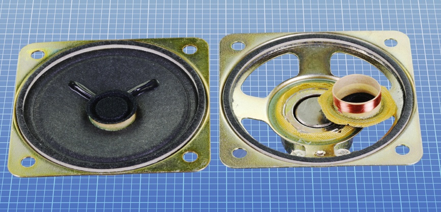 On the left is a 2” speaker. On the right, its cone has been cut away to reveal the magnet, with a circular groove in it. The neck of the cone, which normally slides into the groove, is shown removed.