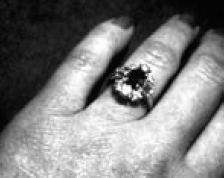 Sapphire and diamond ring worn by federal agent for evidence photo —NIS PHOTO