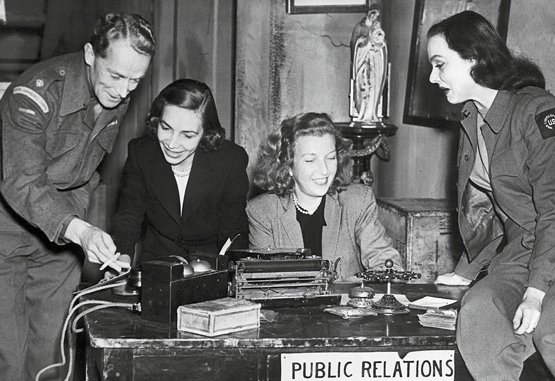 (Original Caption) 6/24/1946-London, England- Martha Gellhorn and Virginia Cowles, American authors who served as war reporters during World War II, flew to England to attend opening night of their play, "Love Goes to War," based on their experiences in Italy. The authors are shown with members of the cast at the Embassy Theatre, Swiss Cottage, London. Left to right: Ralph Michael, who plays a public relations officer in the British army; Virginia Cowles; Martha Gellhorn; and Irene Worth, who plays one of the woman correspondents.