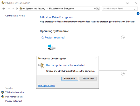 Screen capture depicting  BitLocker Drive Encryption window with Restart Now option in a dialog.