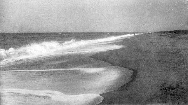 South shore, Martha's Vineyard, Massachusetts, showing a characteristic sand beach with long slope and low dunes. Note the three lines of breakers and the splash flows cutting little bays in the sand.