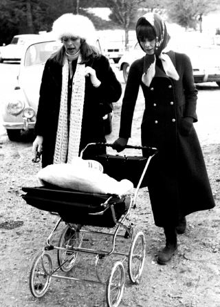 Capucine visits Audrey, wheeling a baby carriage, in Gstaad, Switzerland...