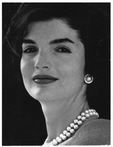 In October of 1972, Jackie threw a surprise party at Manhattan’s El Morocco, celebrating the fourth anniversary of her marriage to Aristotle Onassis—not that that marriage had anything to celebrate. Her guest list included Doris Duke, Rose Kennedy, Oleg Cassini, and such New Frontiersmen warriors of yesterday as Pierre Salinger. Surprise of surprise, she invited William Buckley, Jr. He was shocked, knowing how much she despised him, but he attended anyway. He wished he hadn’t. Years before, he had infuriated her at a party, when he had cheerfully informed her that he was about the expose the myth of Camelot in a book. She waited for almost a decade before confronting him privately at her El Morocco party to inform him of the incriminating data that the Kennedys had amassed on him. “Back off!” she threatened him, “or we’ll destroy you.” He got the message.