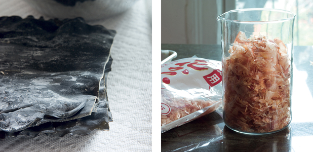 A sheet of black seaweed and a jar of dried bonito flakes