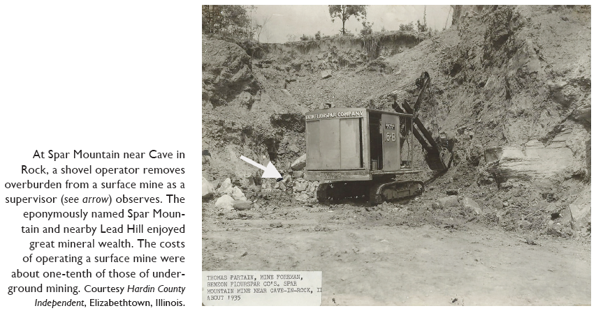 Image: At Spar Mountain near Cave in Rock, a shovel operator removes overburden from a surface mine as a supervisor (see arrow) observes. The eponymously named Spar Mountain and nearby Lead Hill enjoyed great mineral wealth. The costs of operating a surface mine were about one-tenth of those of underground mining. Courtesy Hardin County Independent, Elizabethtown, Illinois.