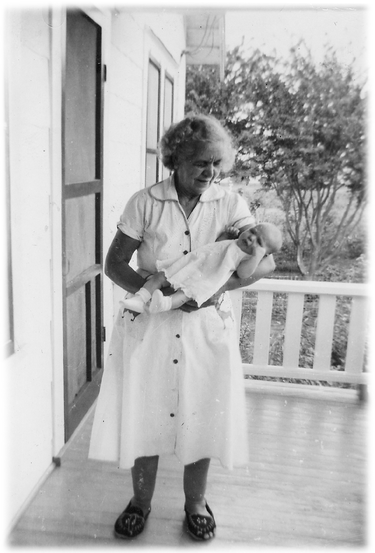 Mawmaw and grandchild on the front porch at the old house