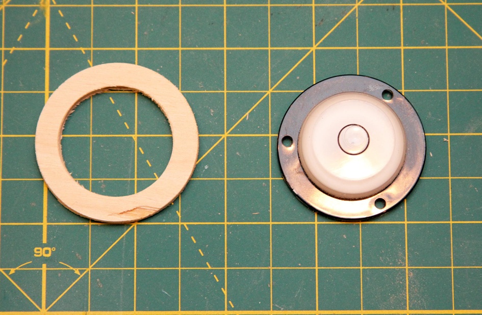 Cut a spacer from 1/8” plywood. This will lower the level enough that it will not interfere with the theodolite’s horizontal needle.