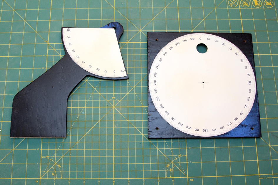 Glue the protractors in place, and then cover with a layer of varnish.