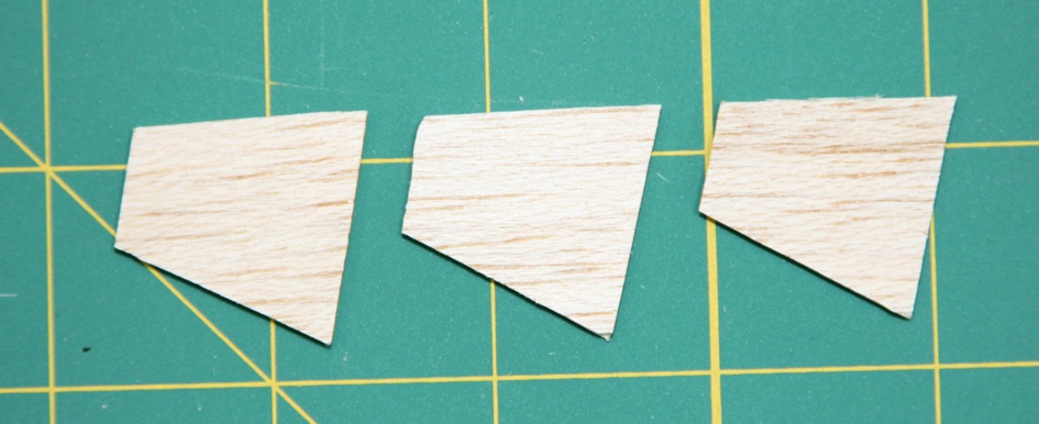 Cut and shape three fins from 1/16” balsa.