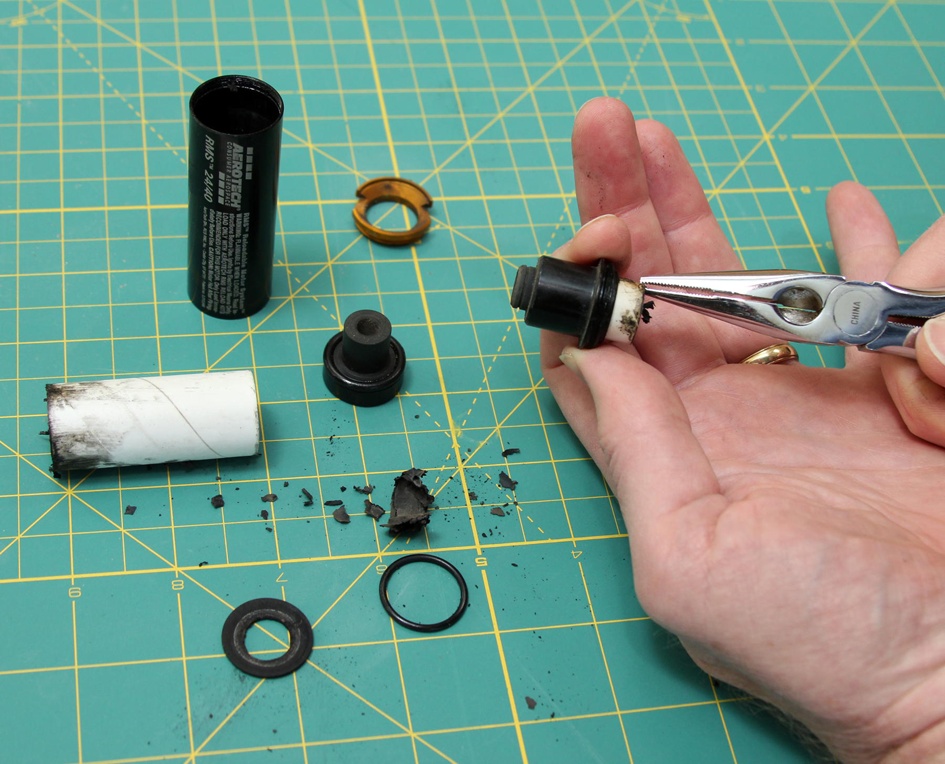 If the delay charge liner doesn’t slide out easily, use needle-nose pliers to pull it out. If the O-ring stays behind, pry it out with something softer than metal, such as a toothpick.