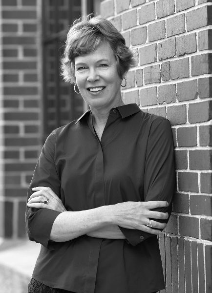 A posed photo of the author, Sara E. Johnson.