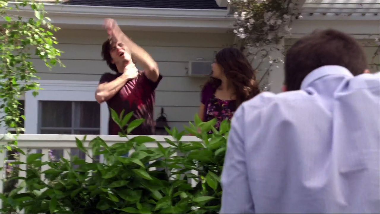 In frame from Modern Family pilot, Phil Dunphy inadvertently shoots Dylan with a pellet gun.