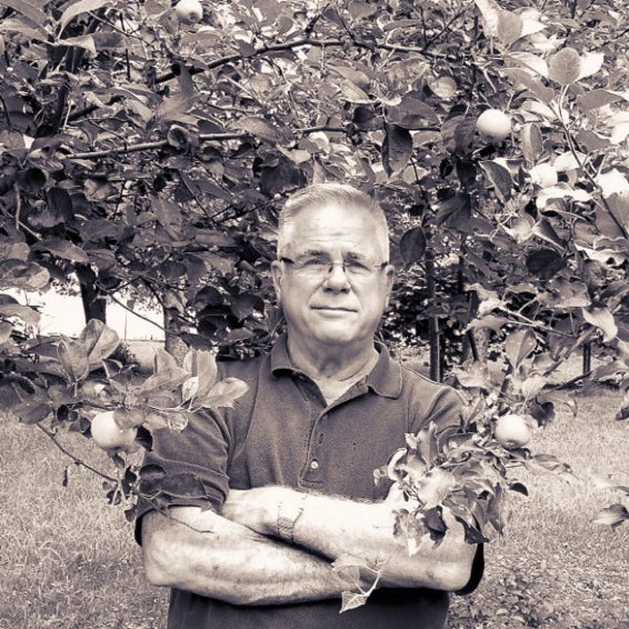 Thomas Adcock in apple orchard, 2015