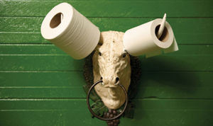 A bull-shaped door knocker with toilet paper rolls on its horns