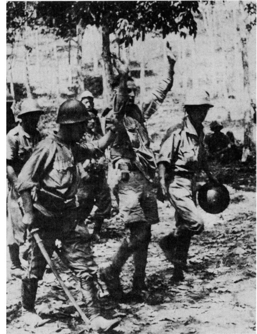 A British soldier is made prisoner during the Malayan campaign