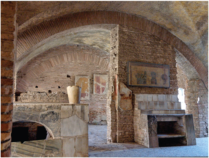 Figure 4.10. Ostia Antica, Thermopolium in the Caseggiato with the same name. Di Marie-Lan Nguyen (User: Jastrow)–Opera propria, CC BY 2.5, https://commons.wikimedia.org/w/index.php?curid=2970505