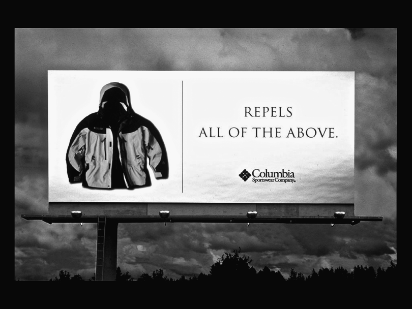 Figure representing a billboard ad for Columbia sportswear company depicting a hooded jacket on the left-hand side and “Repels all of the above” written on the right-hand side. It uses its surroundings to make its point.