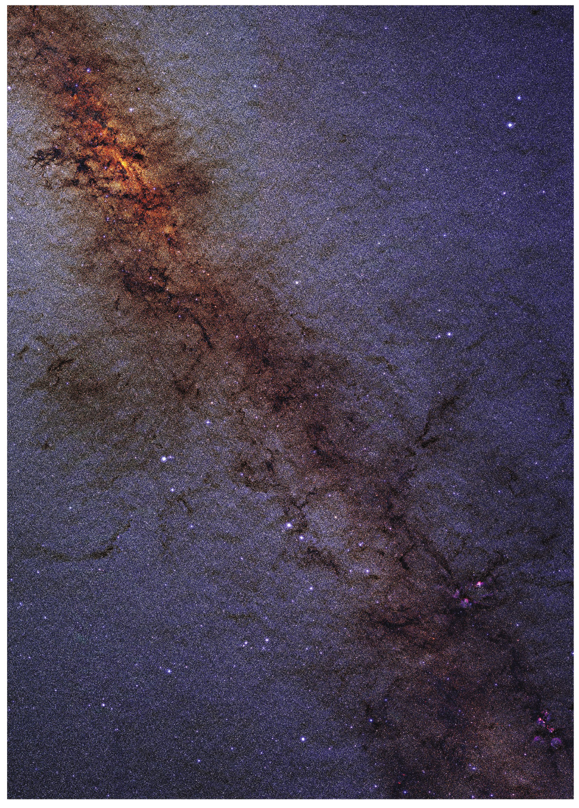  The Milky Way center. The dust of the Milky Way obscures short-wavelength light more than longer wavelengths, giving the stars behind that dust a distinctly reddish tinge. There are about 10 million stars in this image, which measures about 4,000 light-years across. The exact center of the Milky Way is the densest red spot in the upper left.   Atlas image obtained as part of the Two Micron All Sky Survey, a joint project of the University of Massachusetts and the Infrared Processing and Analysis Center/California Institute of Technology, funded by NASA and the NSF