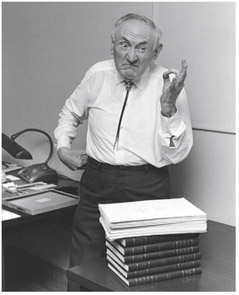  Fritz Zwicky, posing with his catalogs of galaxies.   Archives Caltech