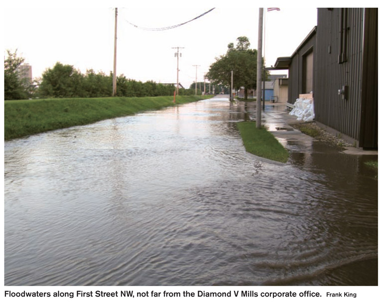 Floodwaters along First Street NW, not far from the Diamond V Mills corporate office. Frank King