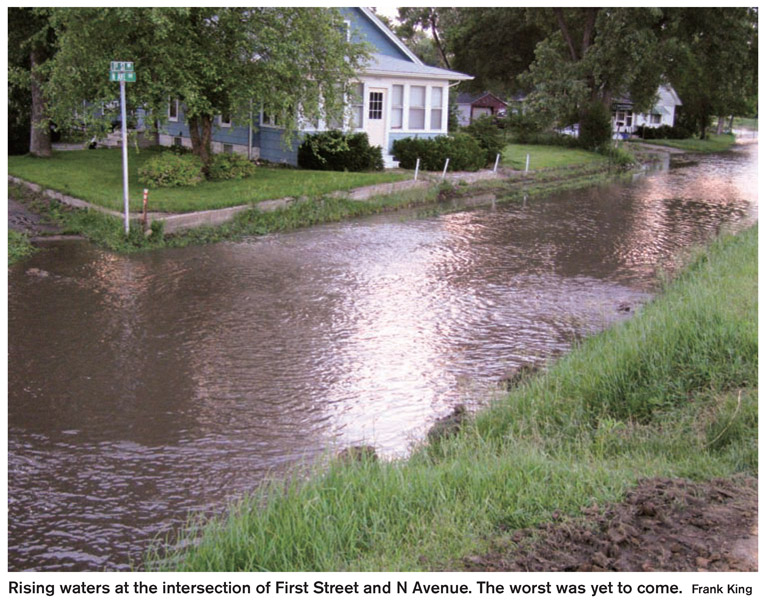 Rising waters at the intersection of First Street and N Avenue. The worst was yet to come. Frank King