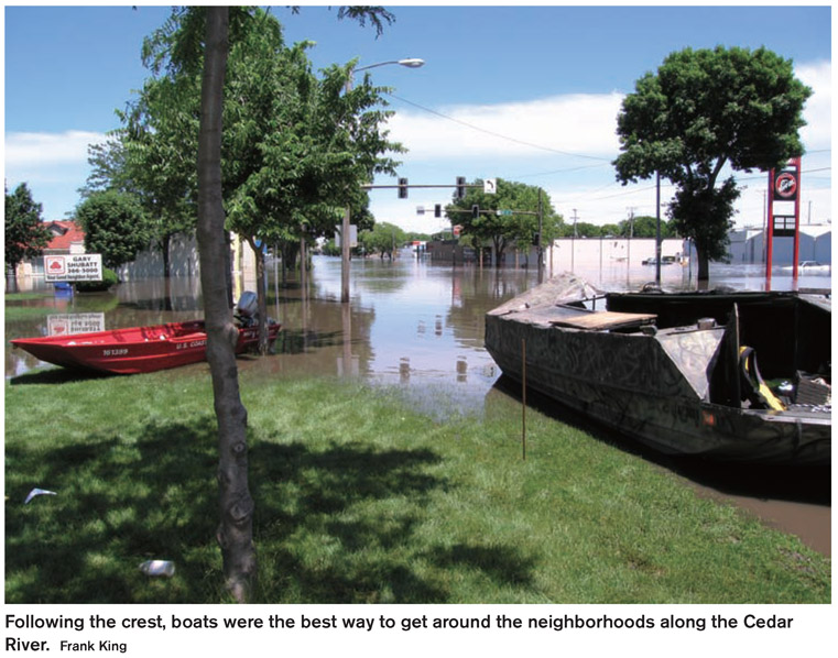 Following the crest, boats were the best way to get around the neighborhoods along the Cedar River. Frank King