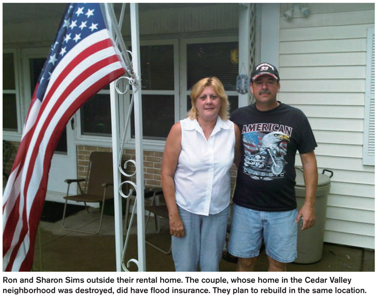 Ron and Sharon Sims outside their rental home. The couple, whose home in the Cedar Valley neighborhood was destroyed, did have flood insurance. They plan to rebuild in the same location.