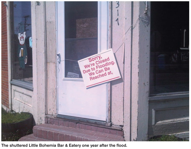 The shuttered Little Bohemia Bar & Eatery one year after the flood.