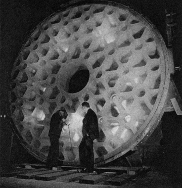 EXAMINING A 200″ TELESCOPE DISC. CORNING