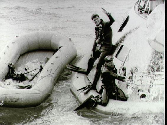 Navy swimmers working on the floatation collar