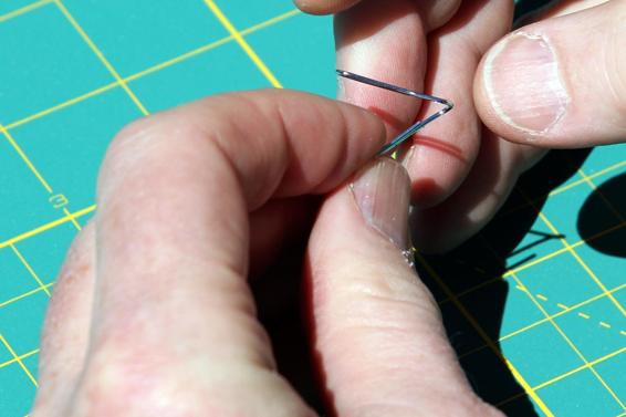 Bend the paper clip up at about a 45-degree angle.