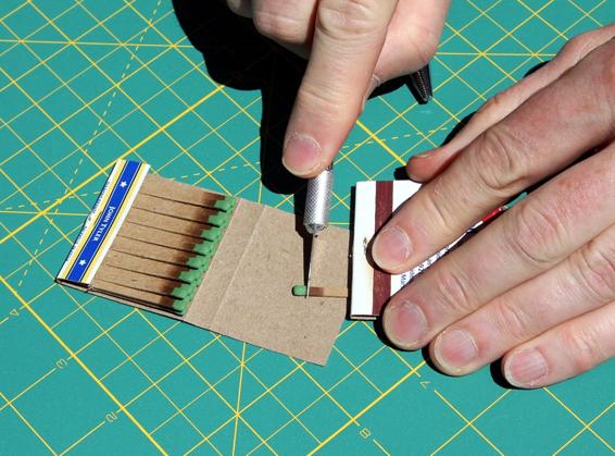 Cut off the match head using a hobby knife or scissors.