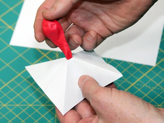 Adding crude fins to a balloon rocket straightens its flight.