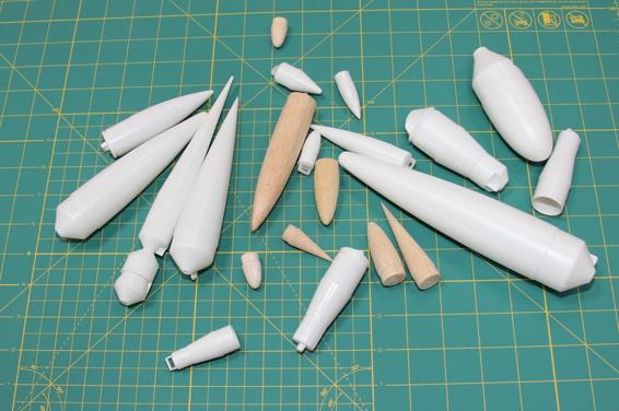 Nose cones come in a variety of sizes, shapes, and materials. Most are plastic or balsa wood.