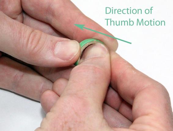 Score the edge of the centering ring to make it easier to slide it onto the motor tube.