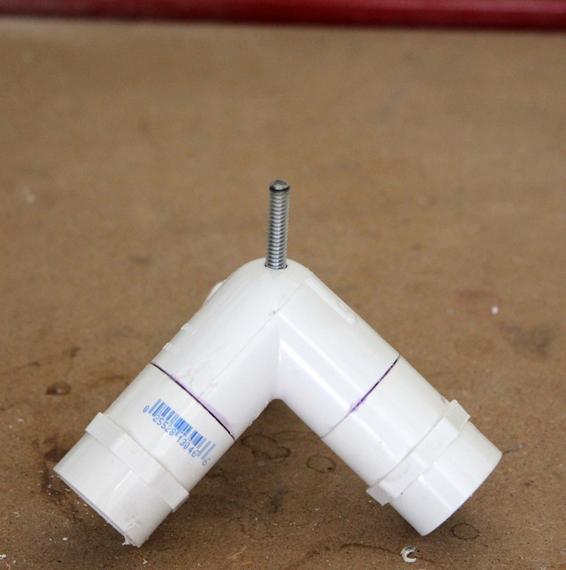 Repeat the process to glue the 1/4” rod into the PVC launch pad head.