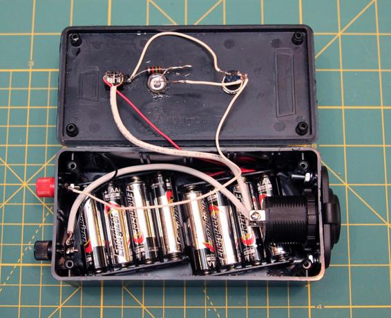 Load the launch controller with eight AA batteries.