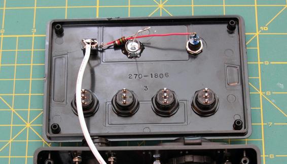 Connect the remaining terminal of the arming switch to the positive side of the LED (the long wire) using a 1.2KΩ or larger 1/4-watt resistor, and to the firing switch using 22-gauge connecting wire.