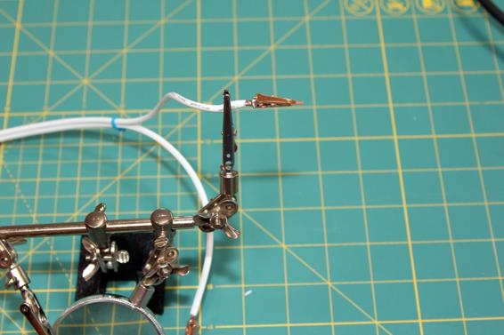 Solder micro clips to the ends of the cable that will connect to the launcher.