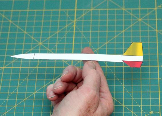 A cutout of a model rocket shows the approximate center of pressure. It’s a bit conservative, but if this test says the rocket is stable, it will be stable.