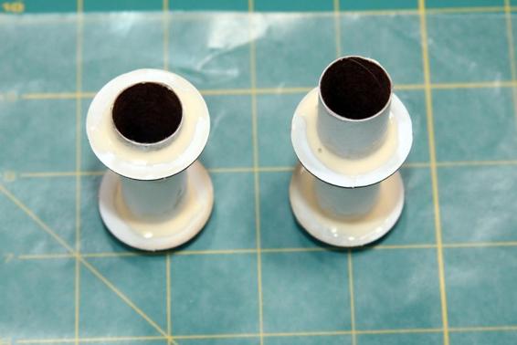 Glue two centering rings 1/4” from one end of each tube. Glue the second centering ring 1/4” from the other end of the shorter tube, and 1” from the other end of the longer tube. Glue the engine block in the longer tube at the end where the centering ring is 1/4” from the end.