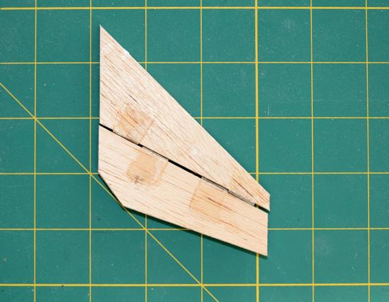 Form hinges with 1” strips of 1/2"-wide ribbon. Keep glue away from the joint between the flap and fin.